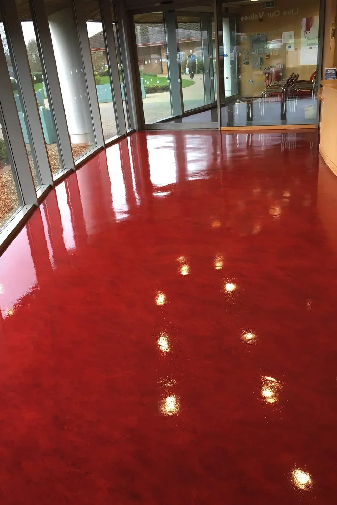 Commercial hard floor cleaning in progress at a business premises