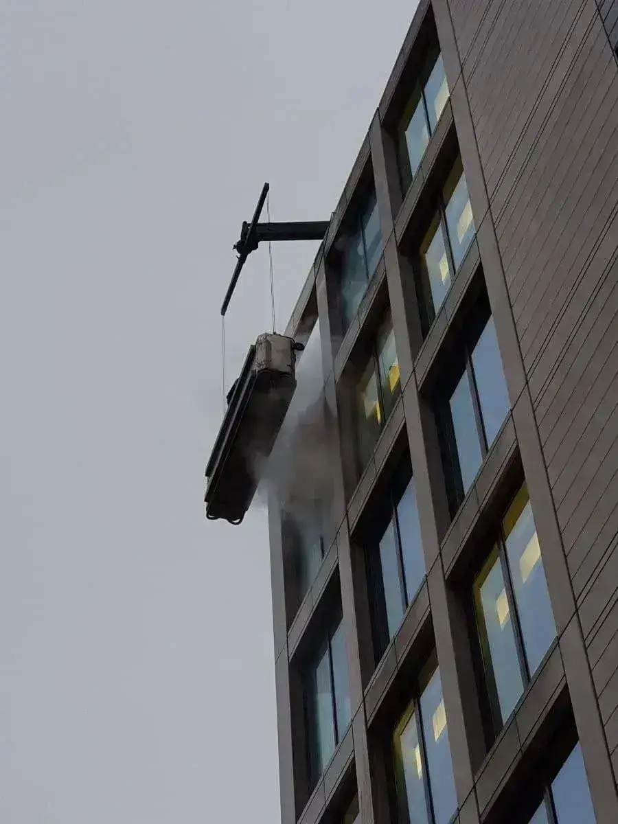 High level cleaning equipment in use at a warehouse