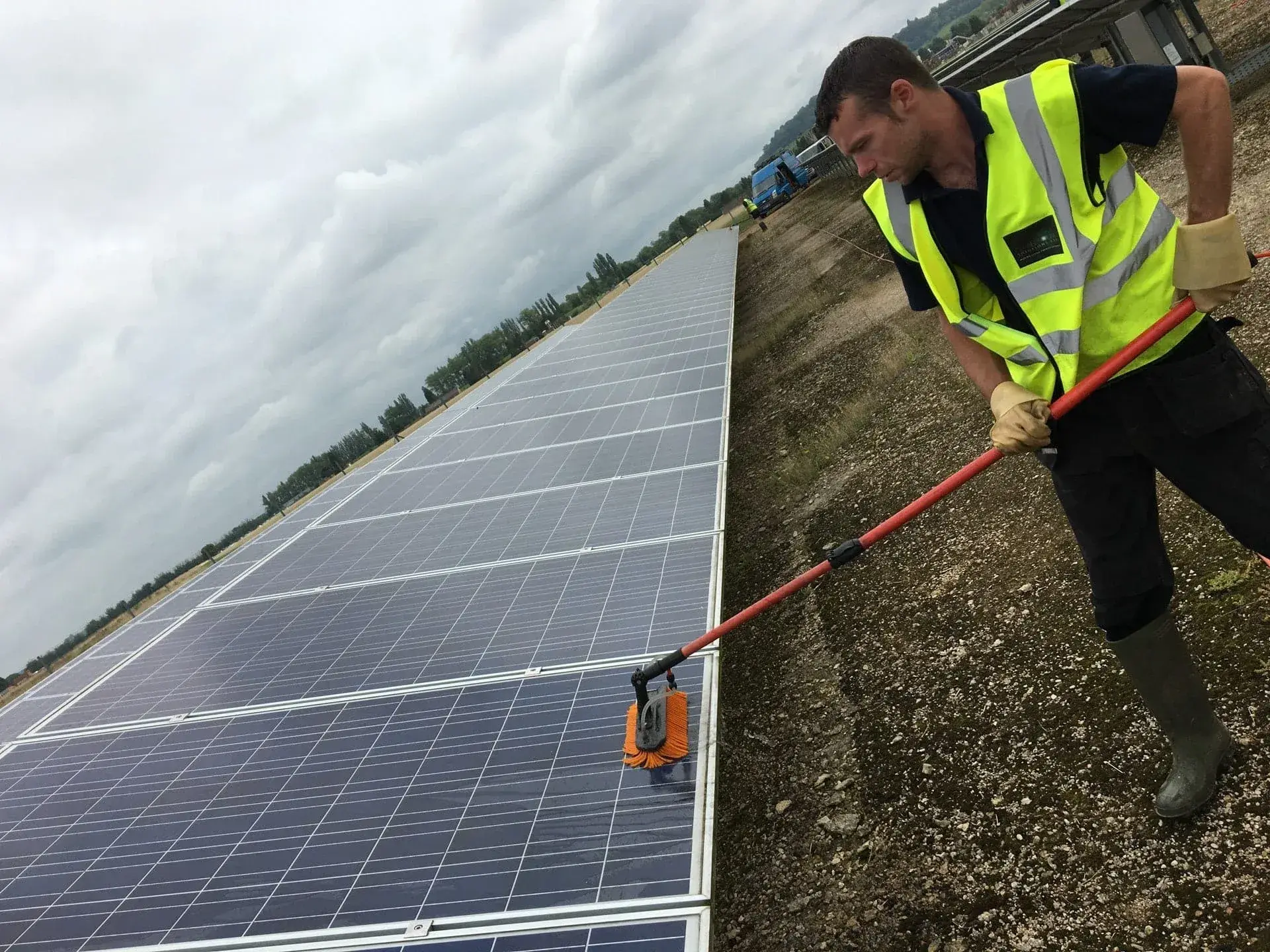 Solar panel array on a commercial rooftop being cleaned