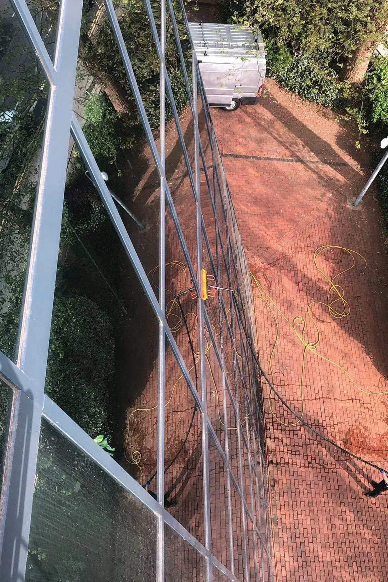 High-level commercial window cleaning with reach and wash