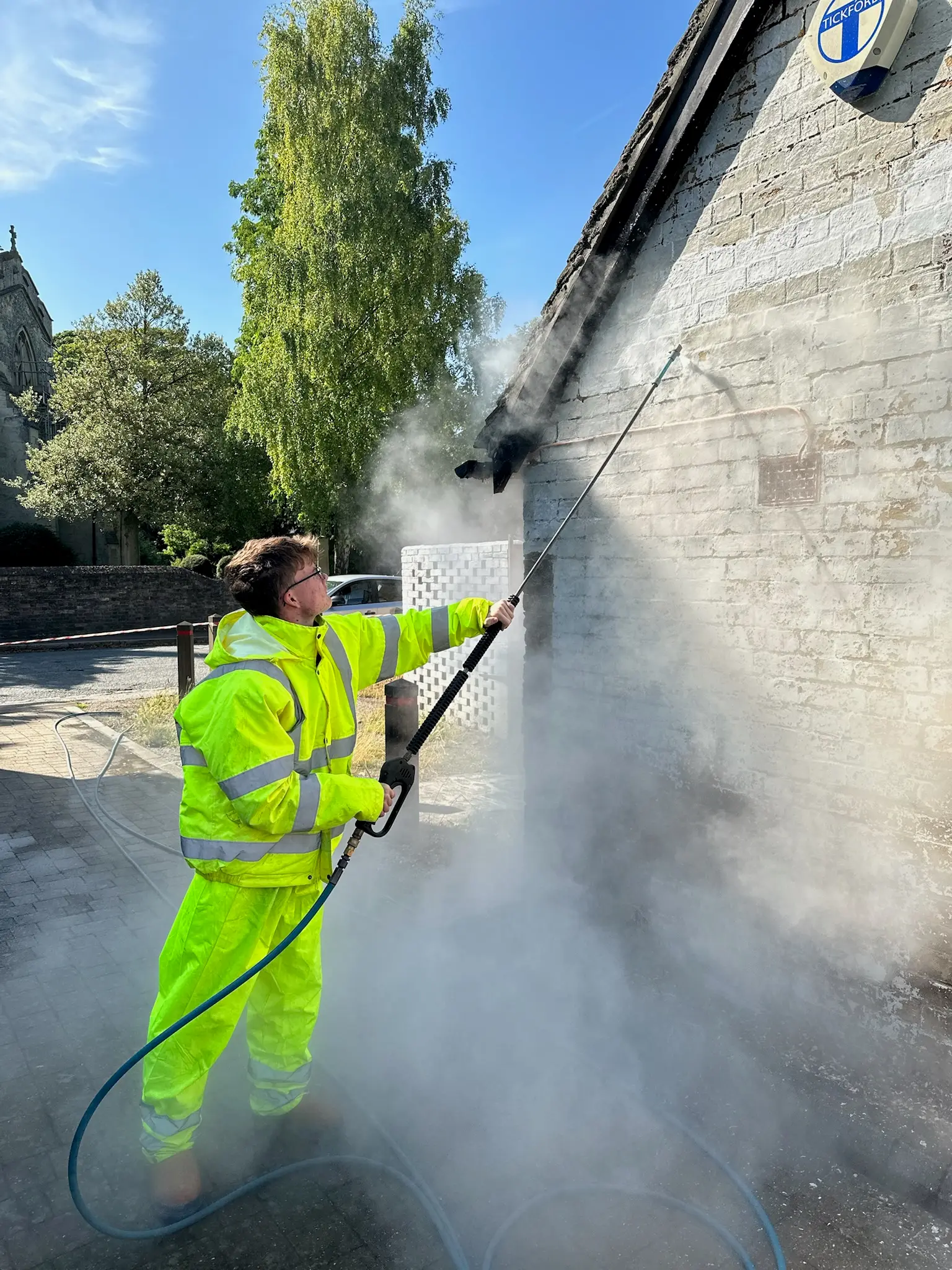 Doff steam cleaning building exterior