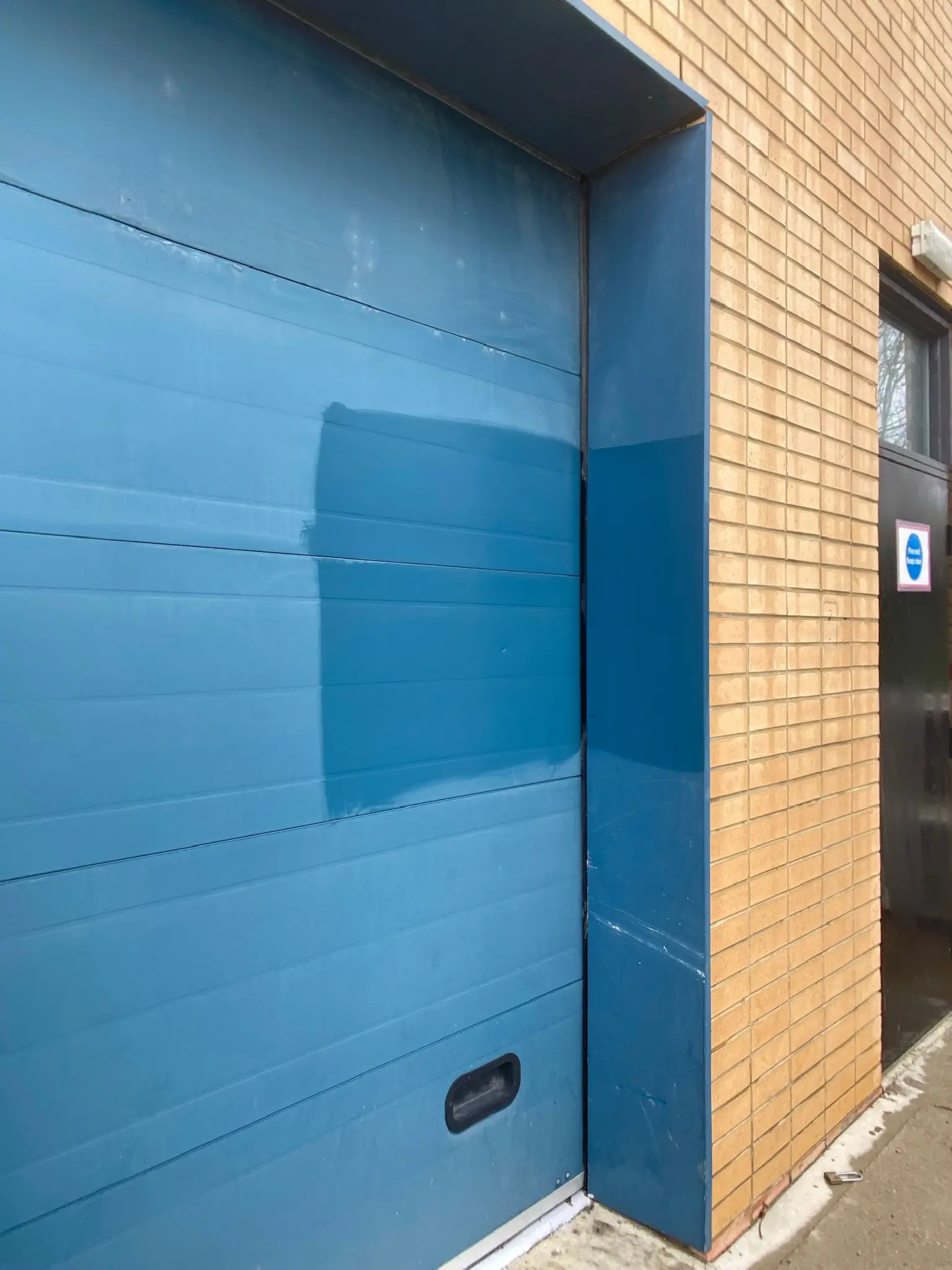 Anodised aluminium cladding restoration showing before and after